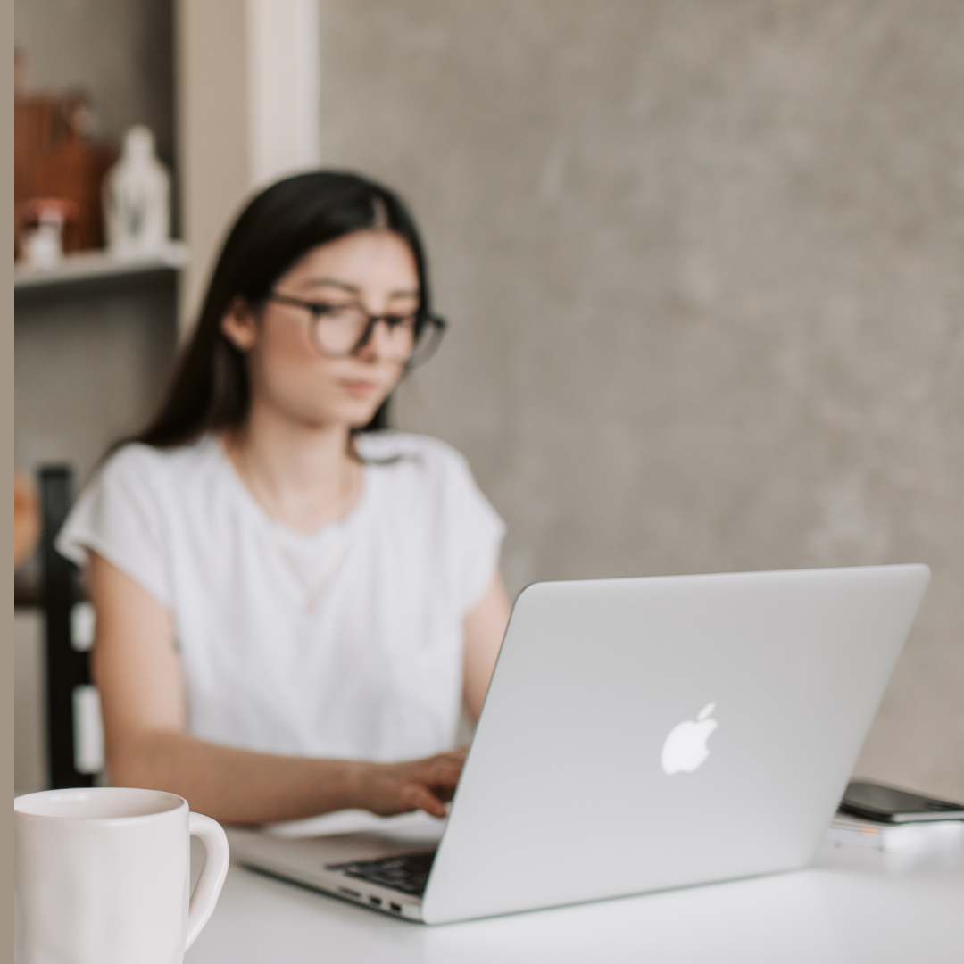 Engineer working on laptop writing CDR report for Engineers Australia