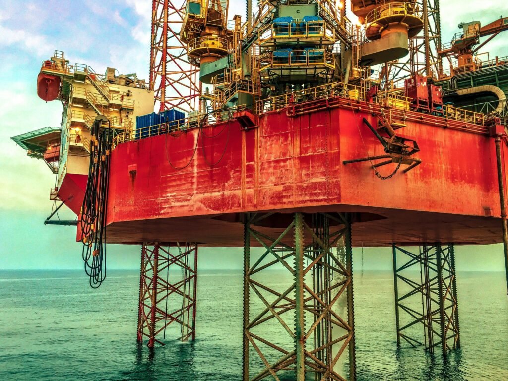 Close-up view of an offshore petroleum drilling platform standing above the sea