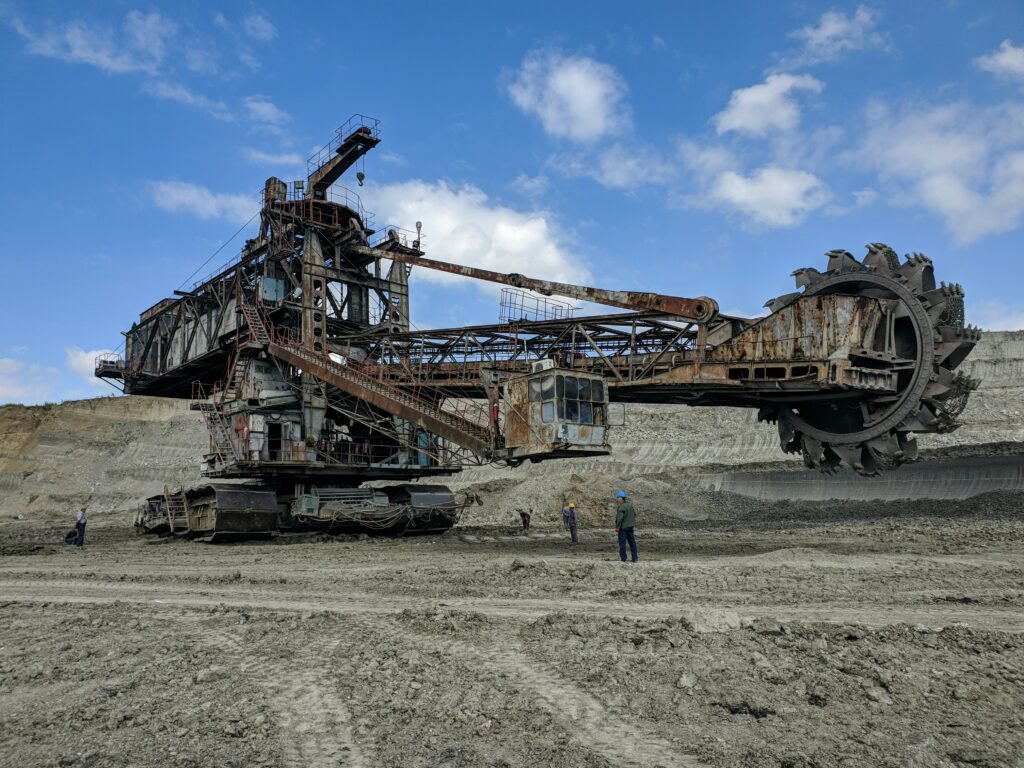 Mining Engineer operating in an underground mine with heavy machinery, representing a professionally prepared CDR Sample for Mining Engineering (ANZSCO 233611), Career Episode Report Sample, mine safety, mineral extraction, and Engineers Australia competency assessment.