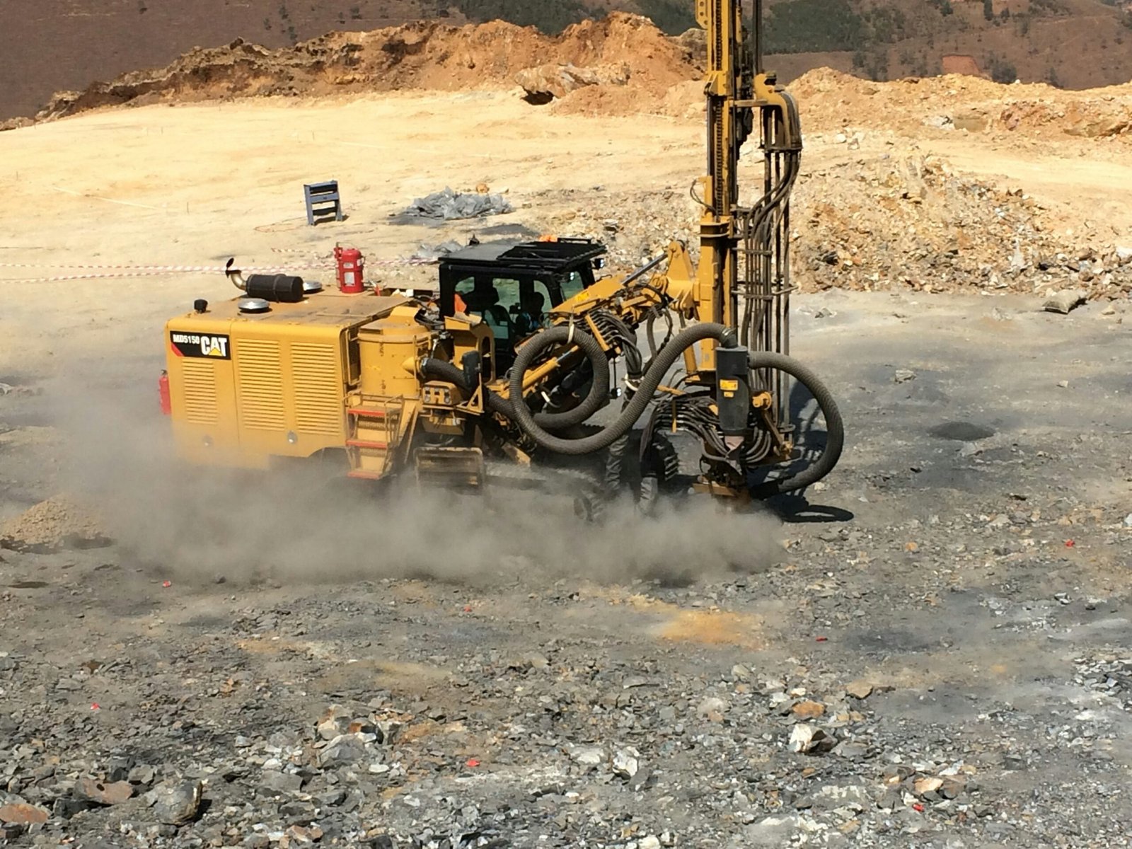 Open-pit mining drill rig used for mineral exploration and rock drilling, representing a Mining Engineer CDR Sample (ANZSCO 233611), Career Episode Report Sample, heavy mining machinery, and Engineers Australia skills assessment