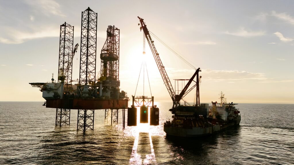 Offshore petroleum platform with a crane vessel during marine oil and gas operations