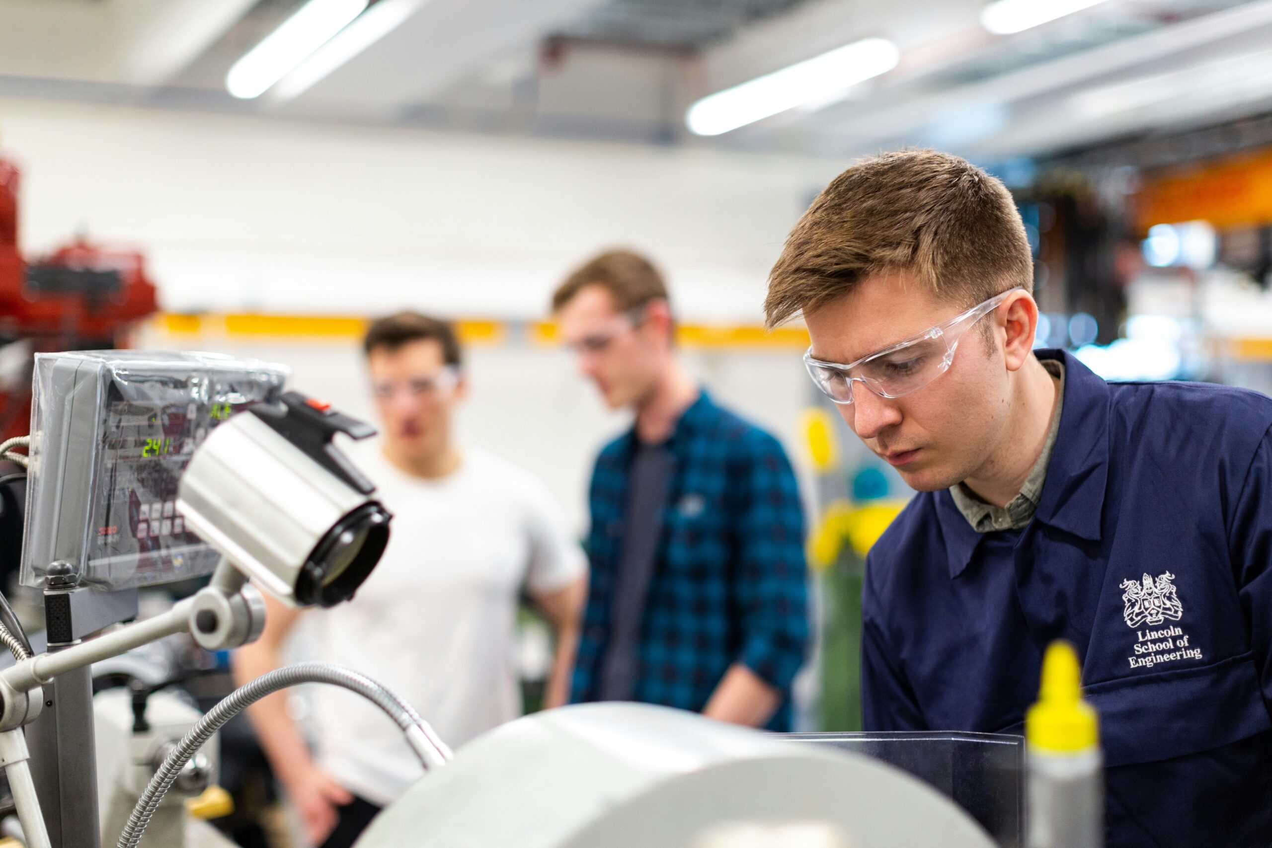 Mechanical engineer using precision machining equipment in workshop - ANZSCO 233512
