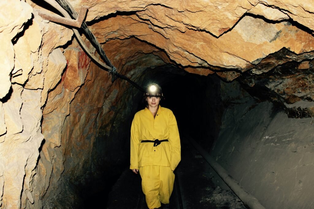 Mining engineer inspecting an underground mine tunnel, representing a Mining Engineer Career Episode Report Sample and CDR Sample for Mining Engineering (ANZSCO 233611), mine safety, underground operations, and Engineers Australia competency assessment.